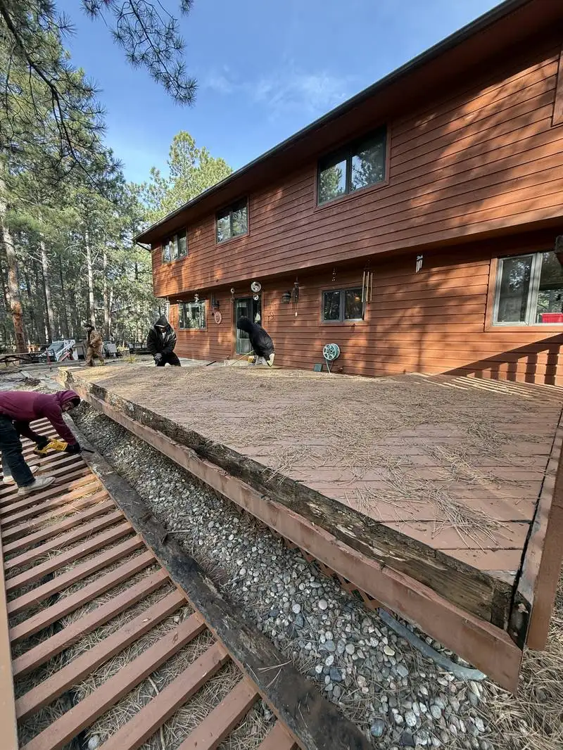 Paver patio with retaining wall in a pine forest setting in Colorado Springs