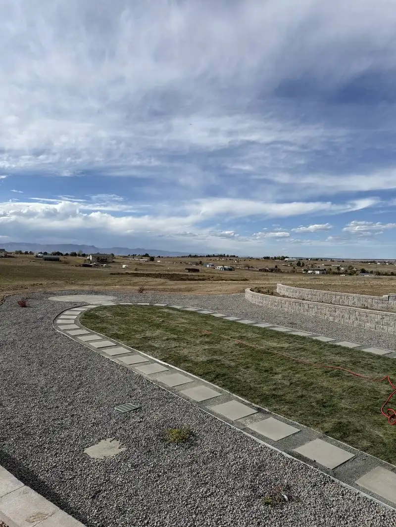 Full landscape design project with native plantings, gravel, and patio in Colorado Springs