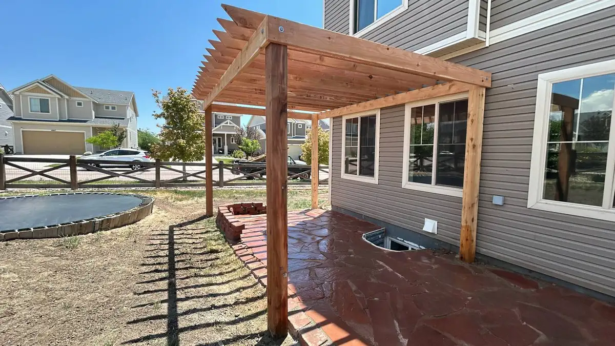 Pergola with flagstone patio outdoor living space in Colorado Springs