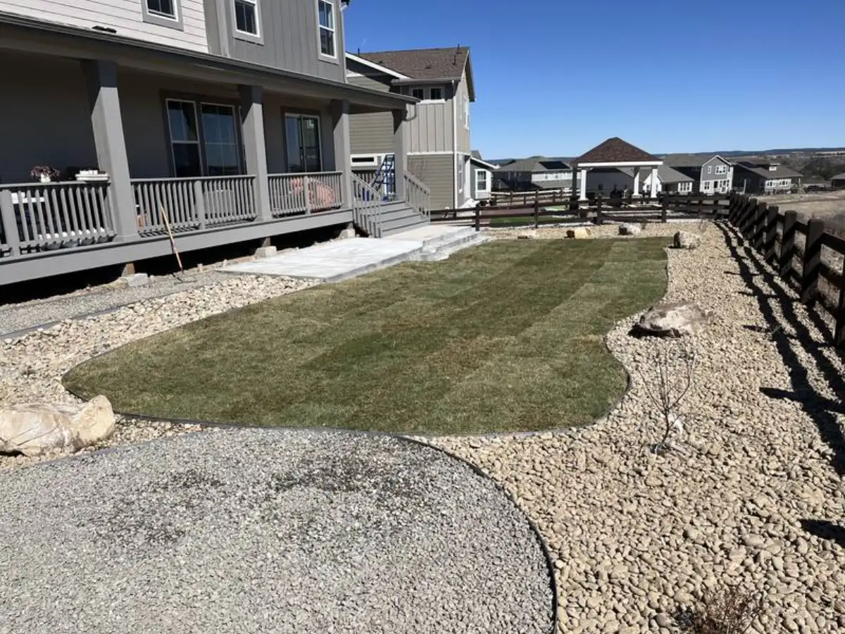 Sod island with gravel ground cover and stepping stones — water-efficient xeriscape